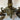 Par de candelabros de bronce patinado patas de león y lagartijas fines s.XIX Bucarest Art & Antiques